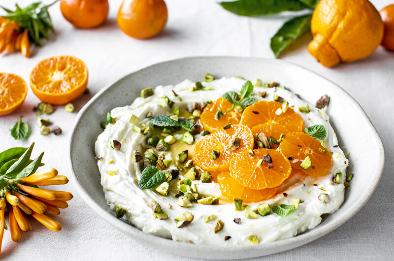 Easy homemade labneh cheese with honey, orange blossom water, pistachios and macerated mandarins.